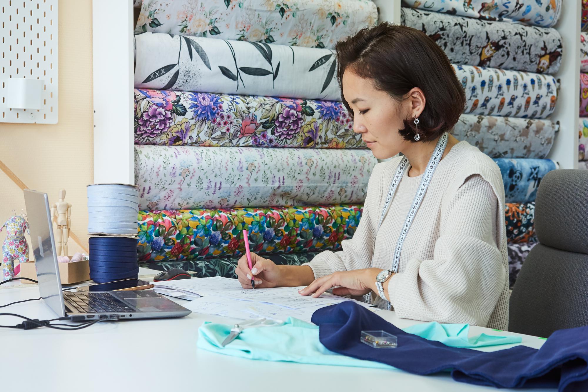 Front of studio with embroidered samples in window